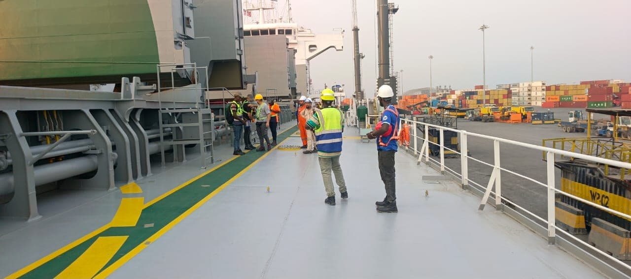 CME supervision crew on a vessel deck at port